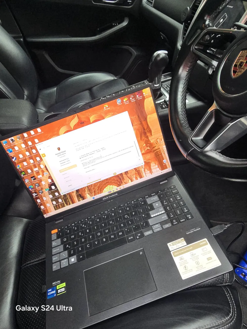 Laptop writing a remap file to a Porsche Macan ECU inside the car