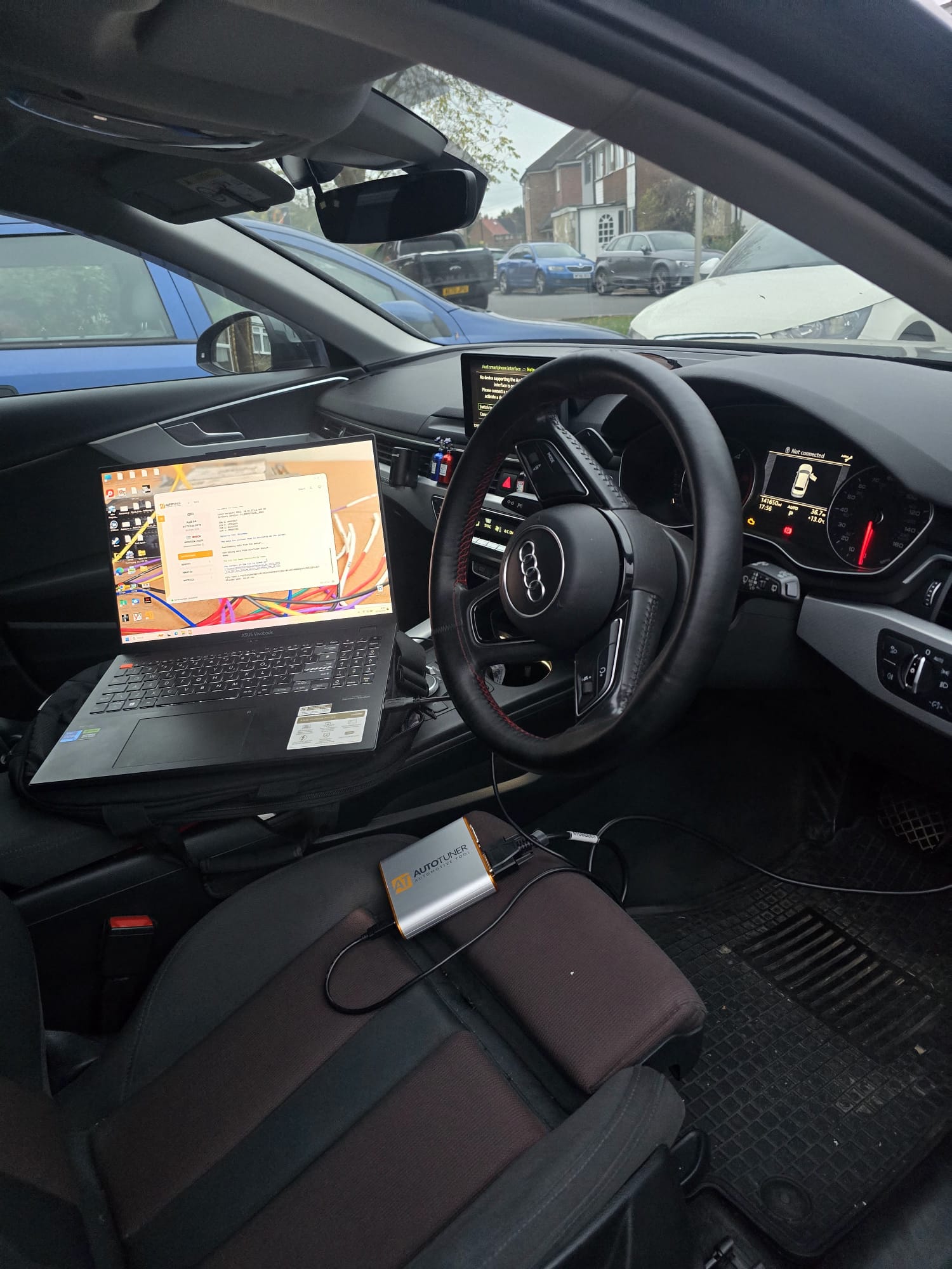 Audi A4 mobile ECU programming with AutoTuner on driveway